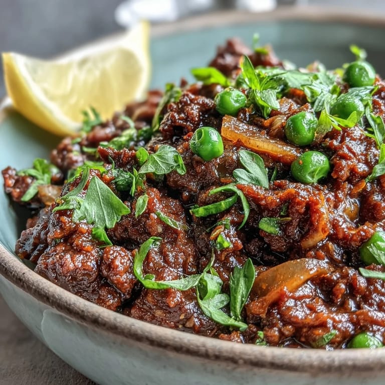 Sizzling Venison Keema Curry in a skillet, garnished with cilantro, ready for a cozy weeknight dinner.