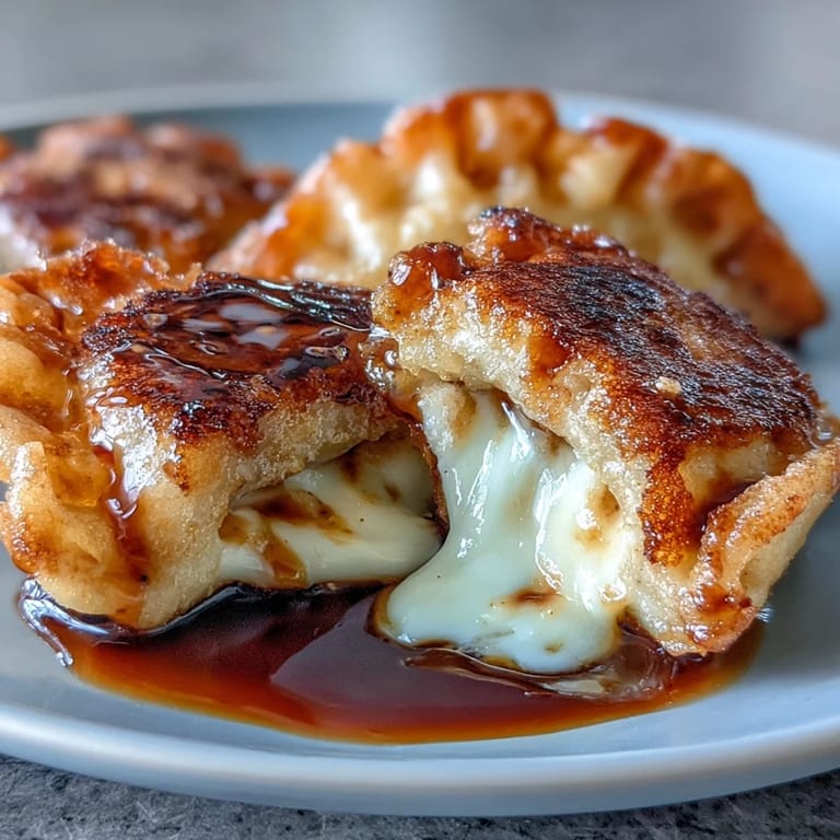 Freshly cooked Chīzu Imomochi arranged on a plate, showcasing the crispy exterior and gooey cheese center.
